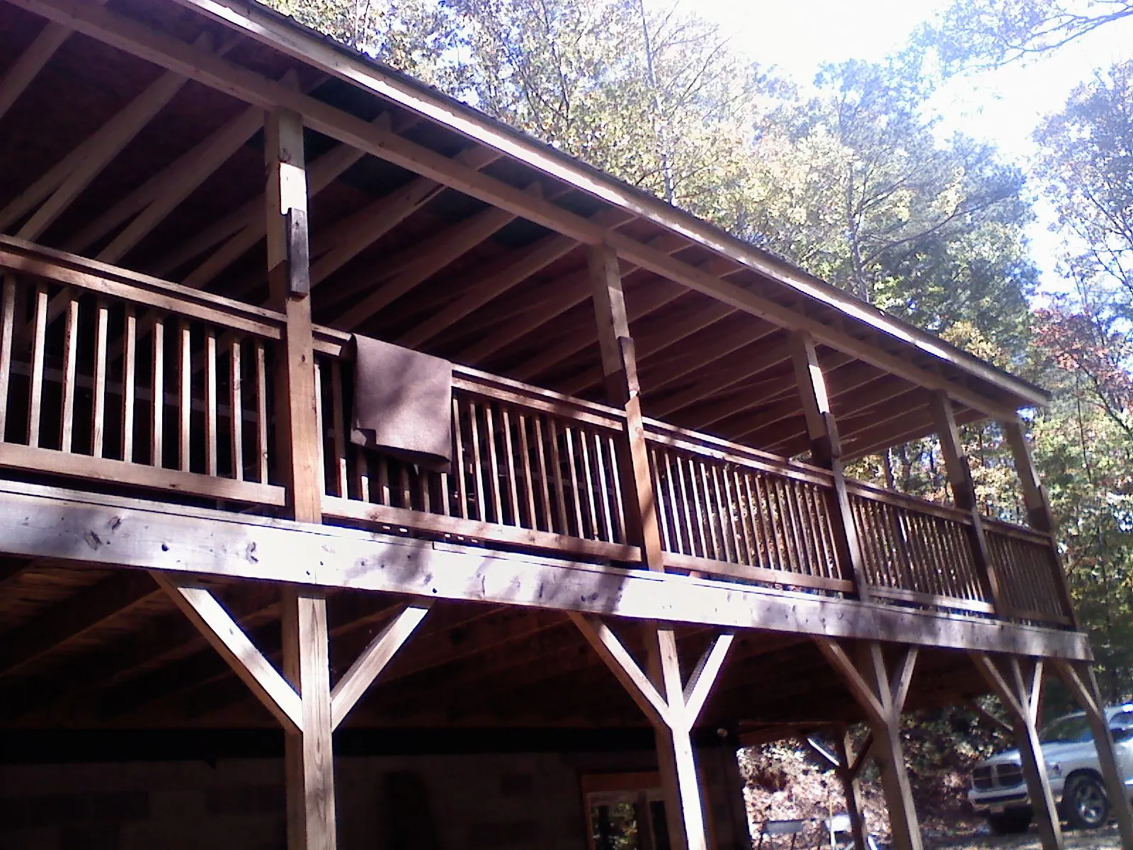 Timber framing under a new elevated porch and deck — Roof Leak Repair in Home by Roofing Brothers